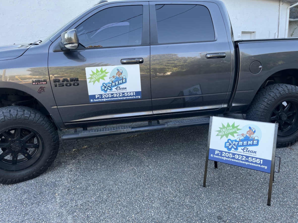 Extreme Clean Pressure Washing truck with branded door magnet and yard sign